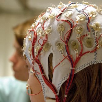 A student and clinician in a neuroscience lab