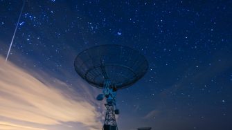 satellite dish under a starry sky