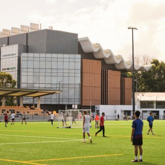 Students enjoying the UNSW Village Green playing sports.