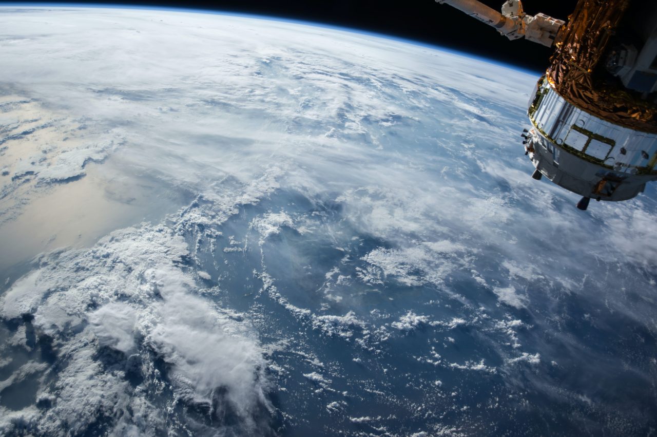 View of Earth and a satellite