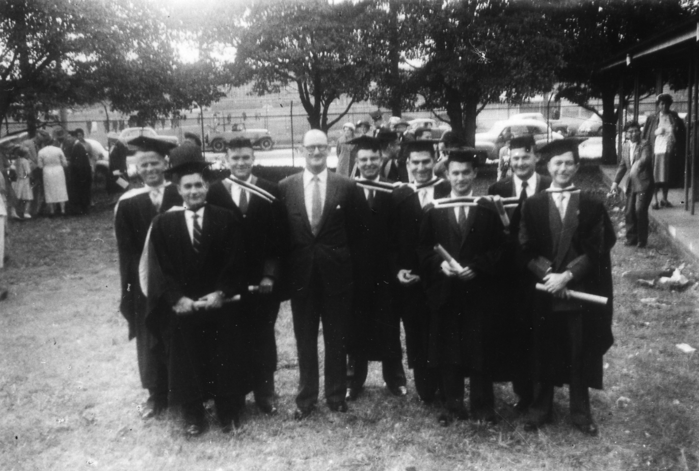 Langer Edward Avery (second from the right) and his Commerce cohort with Professor E. B. Smyth after their 1959 graduation ceremony