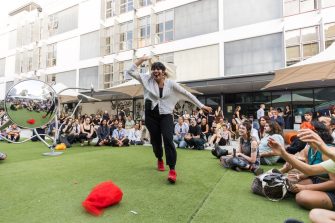 A student performs in the UNSW Paddington campus courtyard during the A&D Annual 2023.