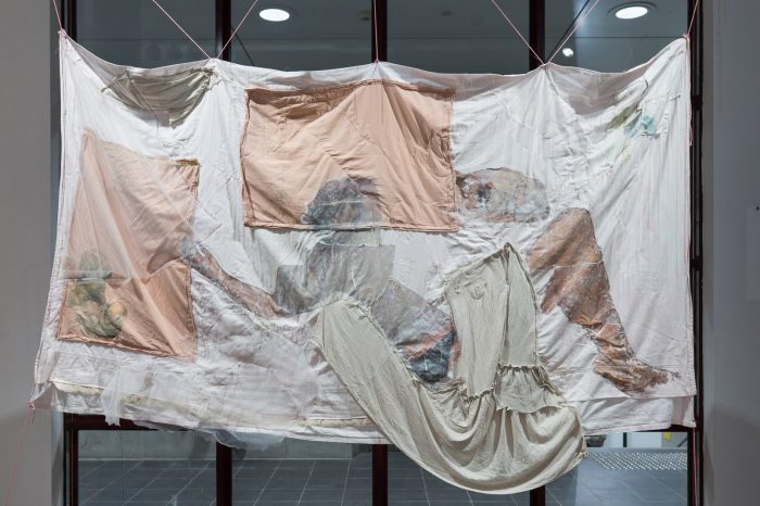 Trinity Johnson, ‘Dreaming of this’ (2025). Found and recycled fabrics and bedding, eucalyptus oil, acrylic medium, thread, beads, earthenware ceramics, 210cm x 165cm. Photograph: Anna Kucera.