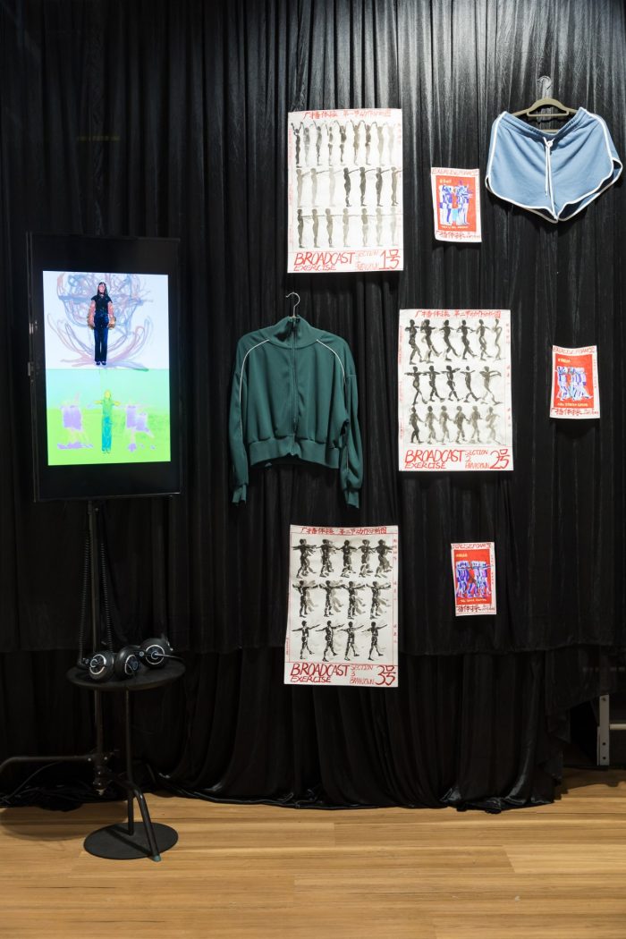 Monica Jie Xu, ‘Body on Repeat: Broadcast Exercise Study’ (2025). Soft-tip colour markers, Chinese black ink, 0.2 mm fineliner pens on 110gsm cartridge paper; mounted on six joined sheets (three A3 and three A4); digital video projection with colour manipulation and motion-trace overlays; bilingual handwritten annotation. Photograph: Anna Kucera.