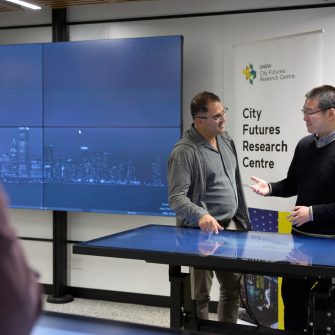 Students using technology in the City Futures Lab at the School of Built Environment
