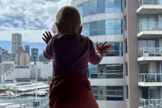 toddler looking outside window 