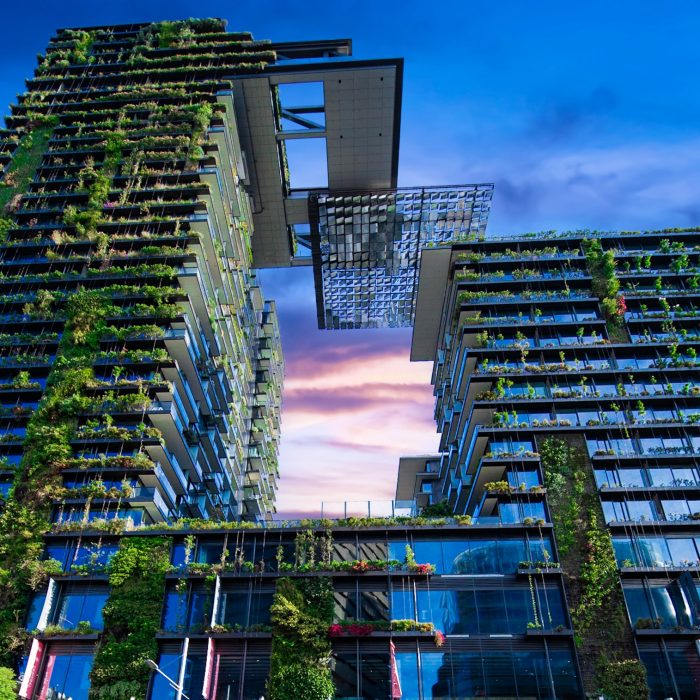 Apartment block in Sydney NSW Australia with hanging gardens and plants on exterior of the building at Sunset with lovely colourful clouds in the sky