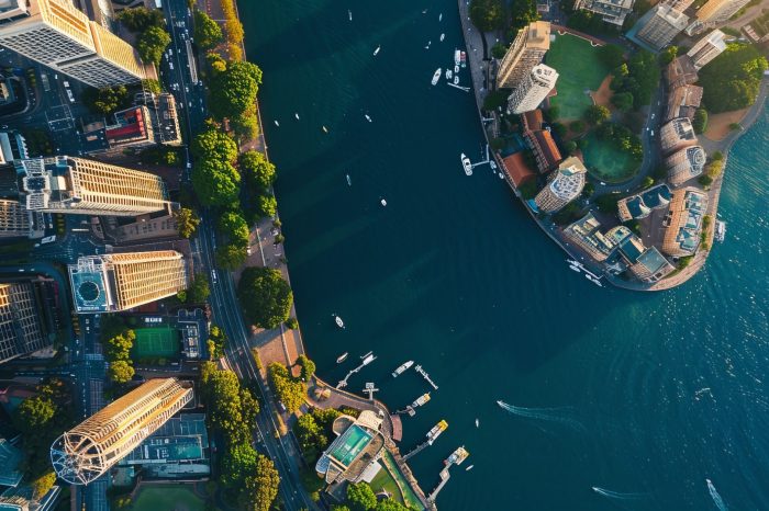 June 20, 2020. Sydney, Australia. Amazing aerial sunset view of the Sydney Opera house from above with Harbour bridge and the bay.