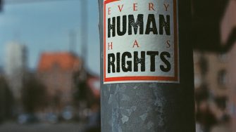 Pole with 'every human has rights' sign