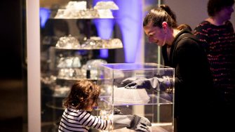 Sydney Science Festival 2018: Launch of Human non Human exhibition in the Turbine Hall. Lily Katakouzinos with daughter, Ayah, using Lindsay Kelley Bundt Cakes interactive in Food section.