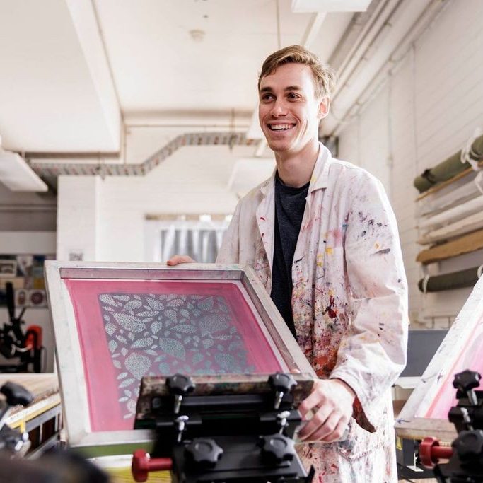 Student displaying screen print