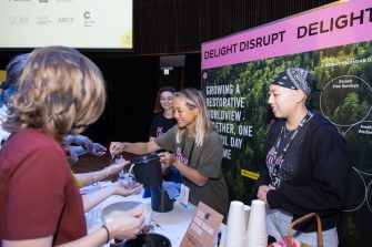Members of the Daily Delight~Disrupt project team interacting with guests at the Massive Action Sydney Unconvention