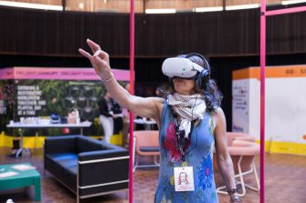 A guest at the Massive Action Sydney Unconvention immersed in a BARC VR experience. 