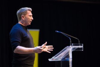 Kevin Finn delivery a keynote speech at the Massive Action Sydney Unconvention