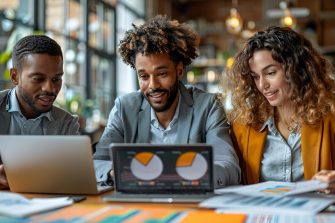 Diverse mid adult students using computers during class in college