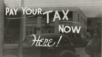 "Pay your tax here" painted on a window. Harlingen, Texas 1939