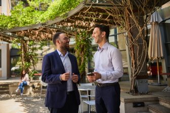 AGSM students working together outside in the courtyard setting on campus