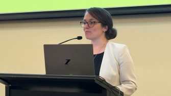 Dr Ariella Meltzer addressing a conference audience.