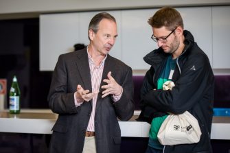 Two attendees in conversation during a networking break at the STEP UP 2019 conference.