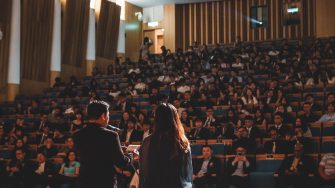 Man giving a speech at an award ceremony