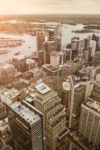 Elevated panorama of downtown Sydney at sunset.