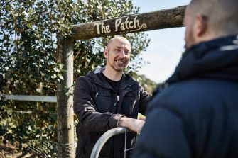 David Sivyer standing in field