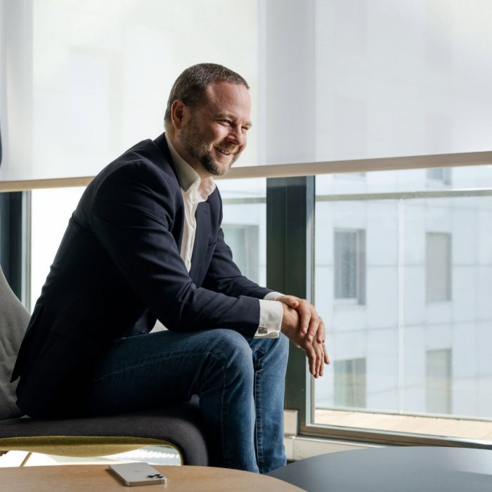 Man sitting on chair smiling