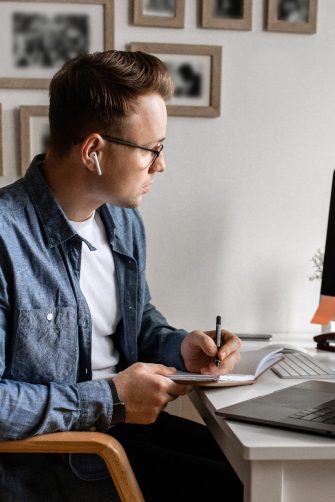 Office at home with IT equipment and online communications. Working at home and remote access concept. Panorama.