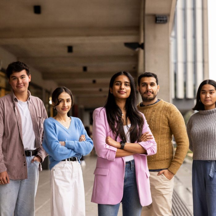 A group of well-dressed students looking directly at the camera