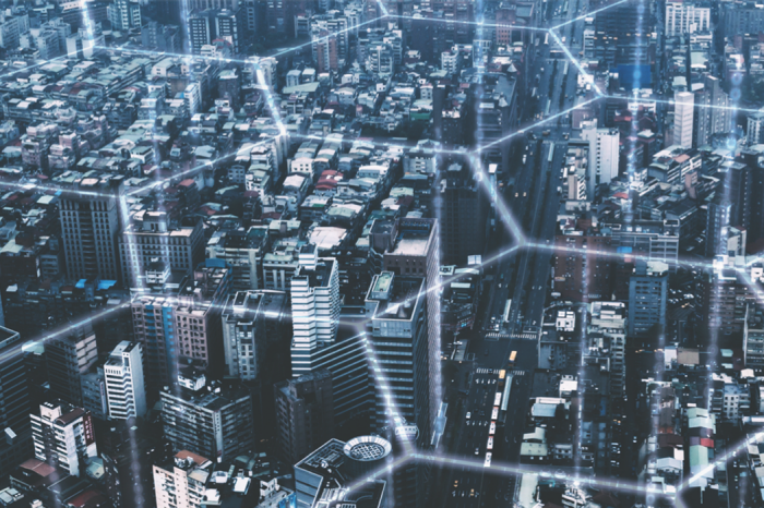 An aerial photograph of a city with a virtual grid over the top