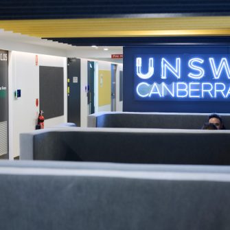 Students sitting inside UNSW Canberra City campus