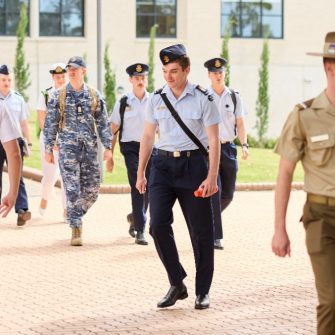 Students in uniform walking through the UNSW Canberra campus