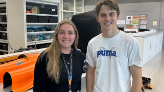 UNSW Canberra student Alina Hutton with Formula 1 star driver Oscar Piastri.