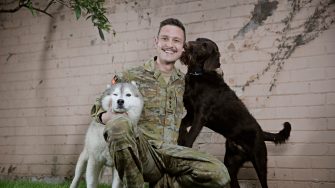 Captain Hugo Toovey with his dogs  Ernie (brown labradoodle) and Iggy (Husky).