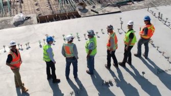 Senior excutives on building site
