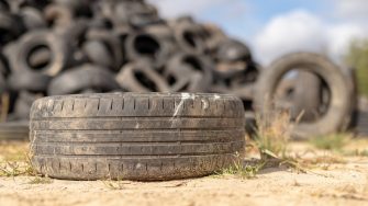 A stack of tires on an old garbage dump
