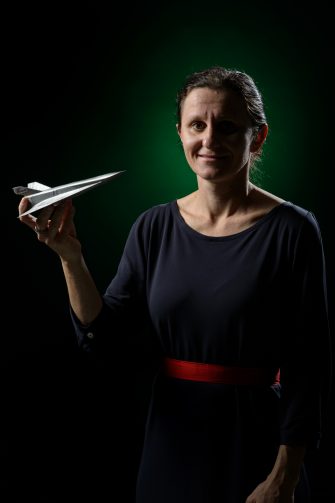 Bianca Capra holding 3D printed rapid prototype models.