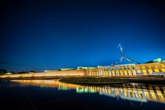Facade of new parliament house in Canberra at night