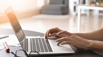 Person using a laptop in modern office