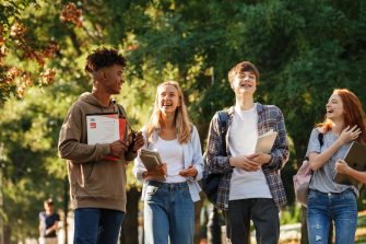 stock photo of four students on a campus