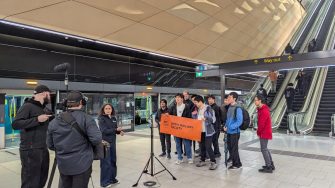 Members of the UNSW Railway Society getting their photo taken