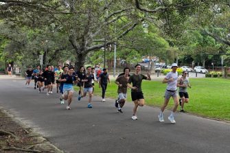 Members of the UNSW Campus Runners running through a park