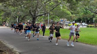 Members of the UNSW Campus Runners running through a park