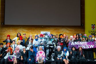 UNSW Anime Society members posing with their Arc banner