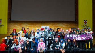 UNSW Anime Society members posing with their Arc banner