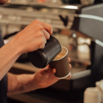 Person pouring a coffee