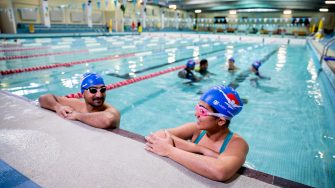 Students swimming on a pool as part of the Learn to Swim Program