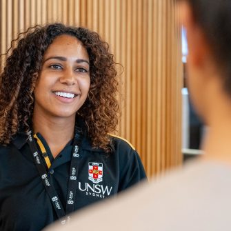 A UNSW staff member in conversation with a student