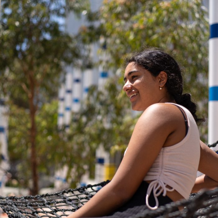 Students relaxing on the hammocks at Alumni Park on the UNSW Kensington Campus