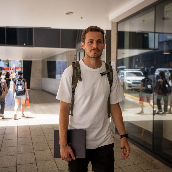A student  outside a building on UNSW Kensington Campus